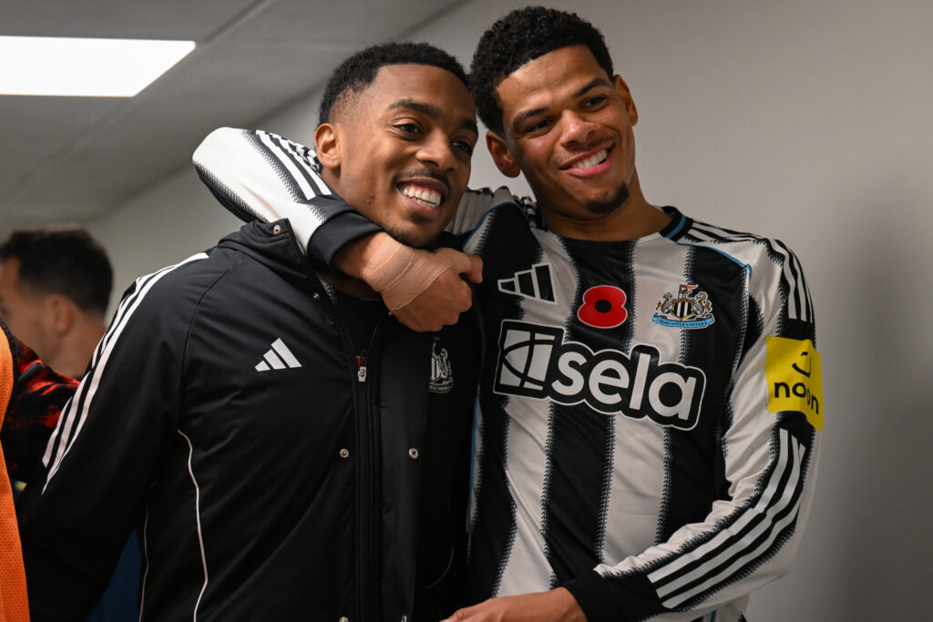Joe Willock and Will Osula celebrate Newcastle United's Carabao Cup win over Tottenham Hotspur.