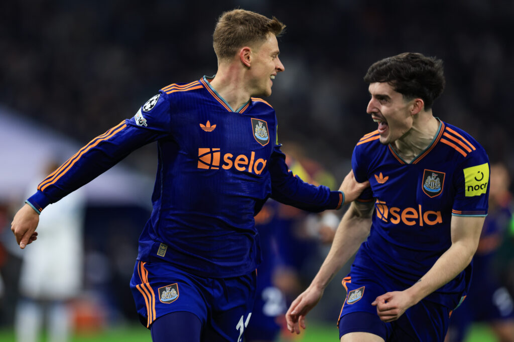Harvey Barnes celebrates scoring for Newcastle United with Tino Livramento.