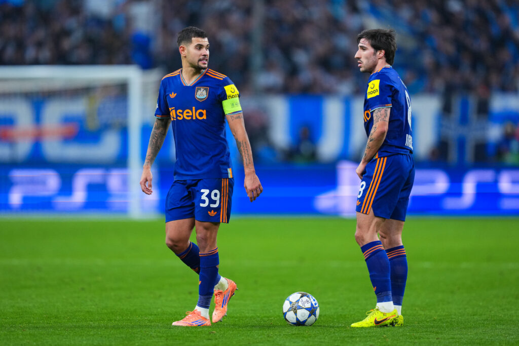 Sandro Tonali talks with Bruno Guimaraes during Newcastle United vs Marseille in the Champions League.