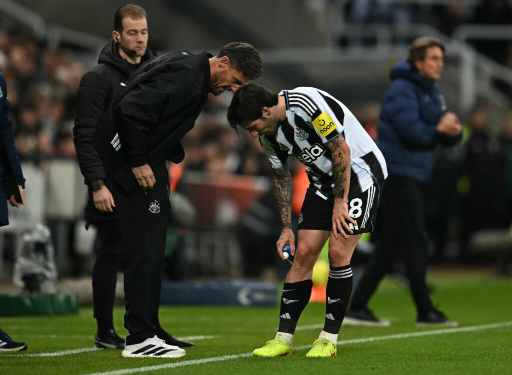 Sandro Tonali sprays his knee during Newcastle United vs Tottenham Hotspur.