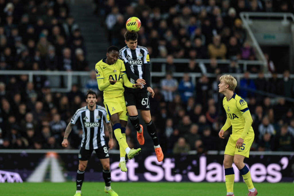 Lewis Miley wins a header during Newcastle United vs Spurs.
