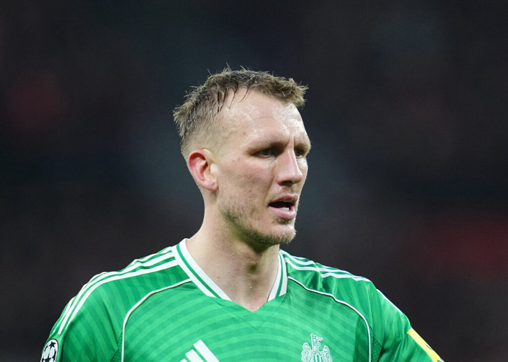 Dan Burn playing for Newcastle United against Bayer Leverkusen.