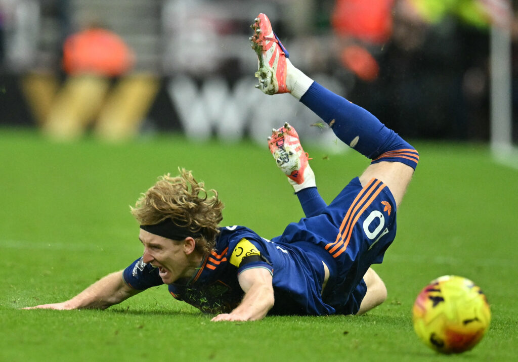 Anthony Gordon hits the floor during Newcastle United's Premier League game against Sunderland.