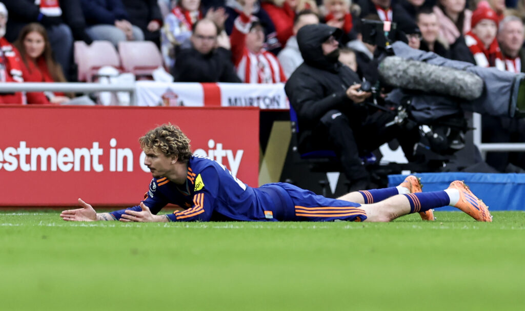 Nick Woltemade lies on the pitch during Sunderland vs Newcastle United.