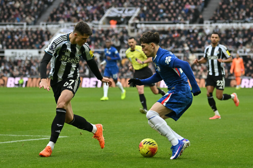 Lewis Miley looks to tackle Alejandro Garnacho during Newcastle United vs Chelsea.