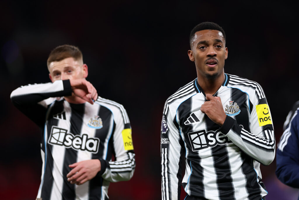 Joe Willock and Harvey Barnes look dejected after Newcastle United lose to Manchester United.