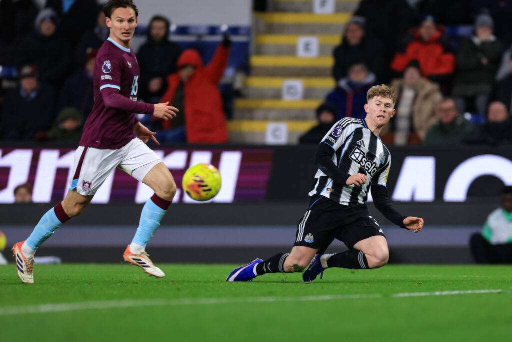 Lewis Hall crosses the ball during Newcastle United's Premier League game against Burnley.