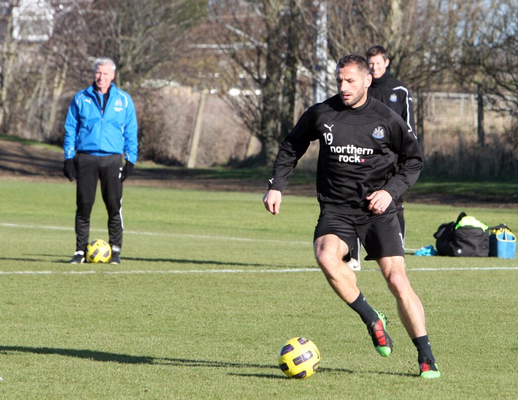 Alan Pardew watches Shefki Kuqi in Newcastle United training.
