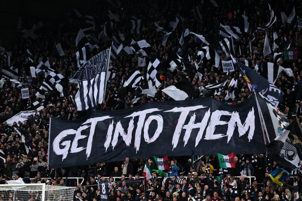 Newcastle United fans hold up a giant banner reading 'Get into them' before their Carabao Cup semi-final second leg against Arsenal at St James' Park.