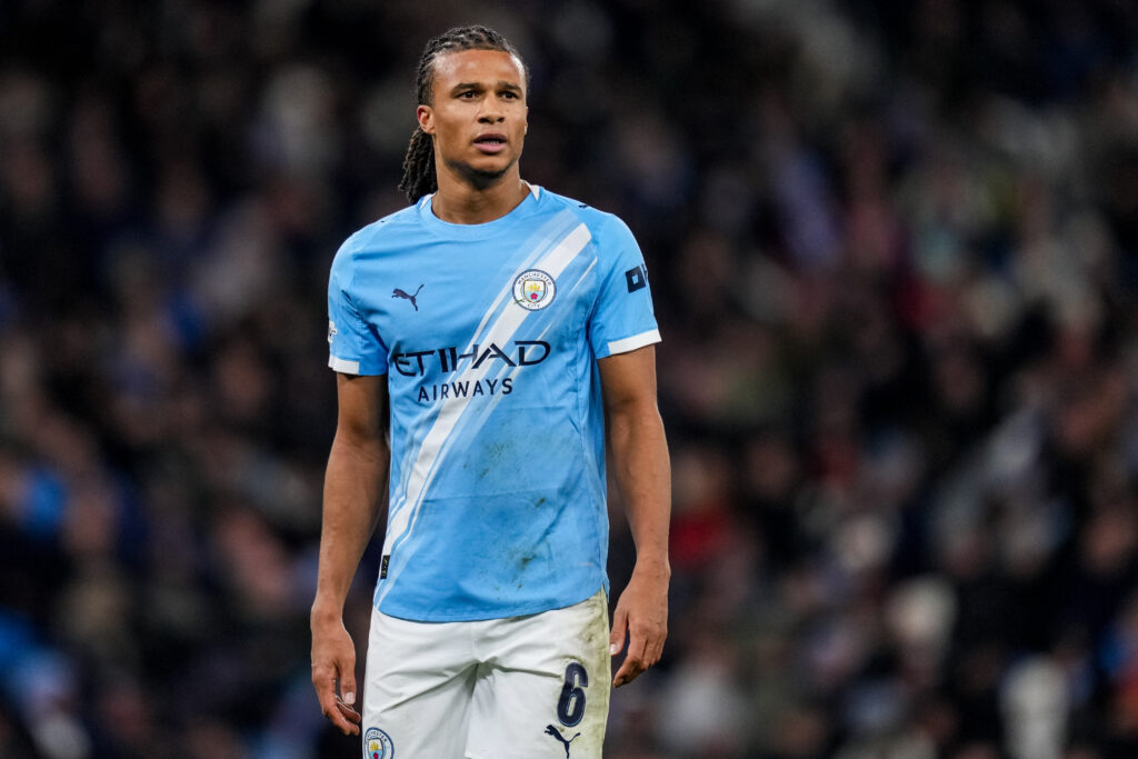 Nathan Ake playing for Manchester City against Bayer Leverkusen.