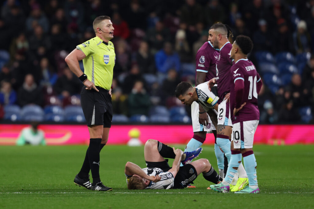 Lewis Hall is down injured during Burnley vs Newcastle United.