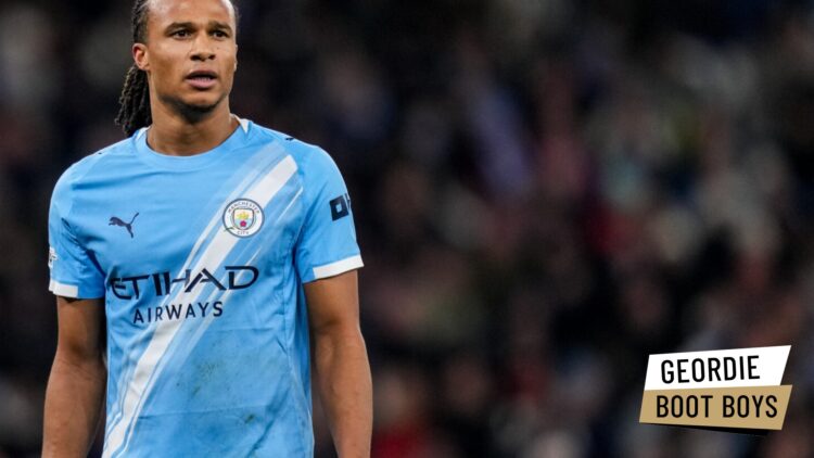 Nathan Ake playing for Manchester City against Bayer Leverkusen. A 'Geordie Boot Boys' logo has been added.