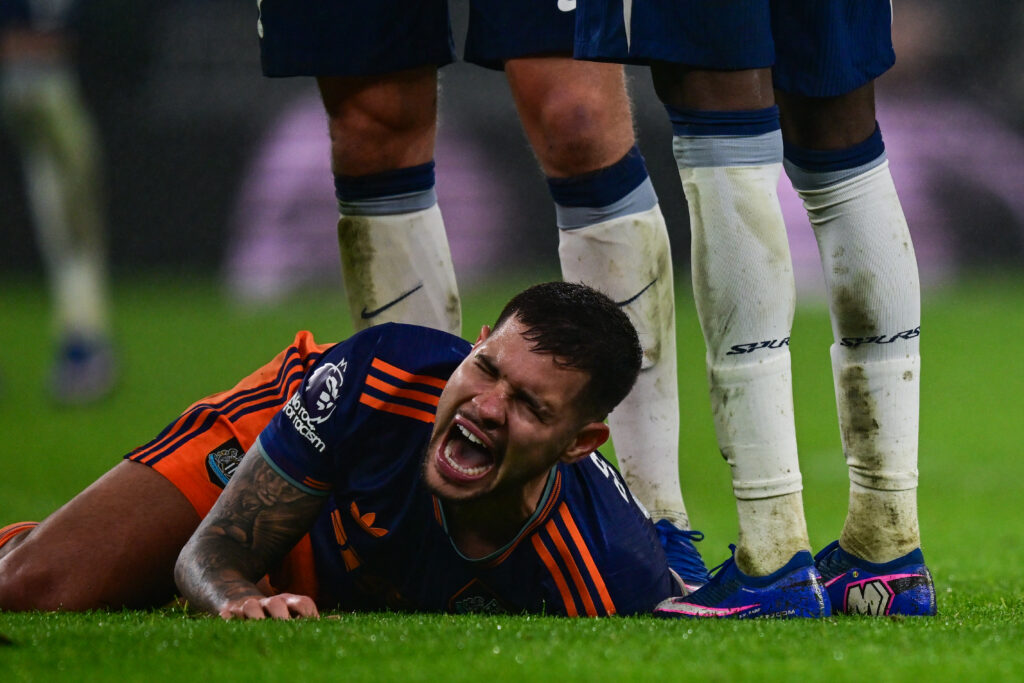 Bruno Guimaraes screams after suffering an injury while playing for Newcastle United against Tottenham.