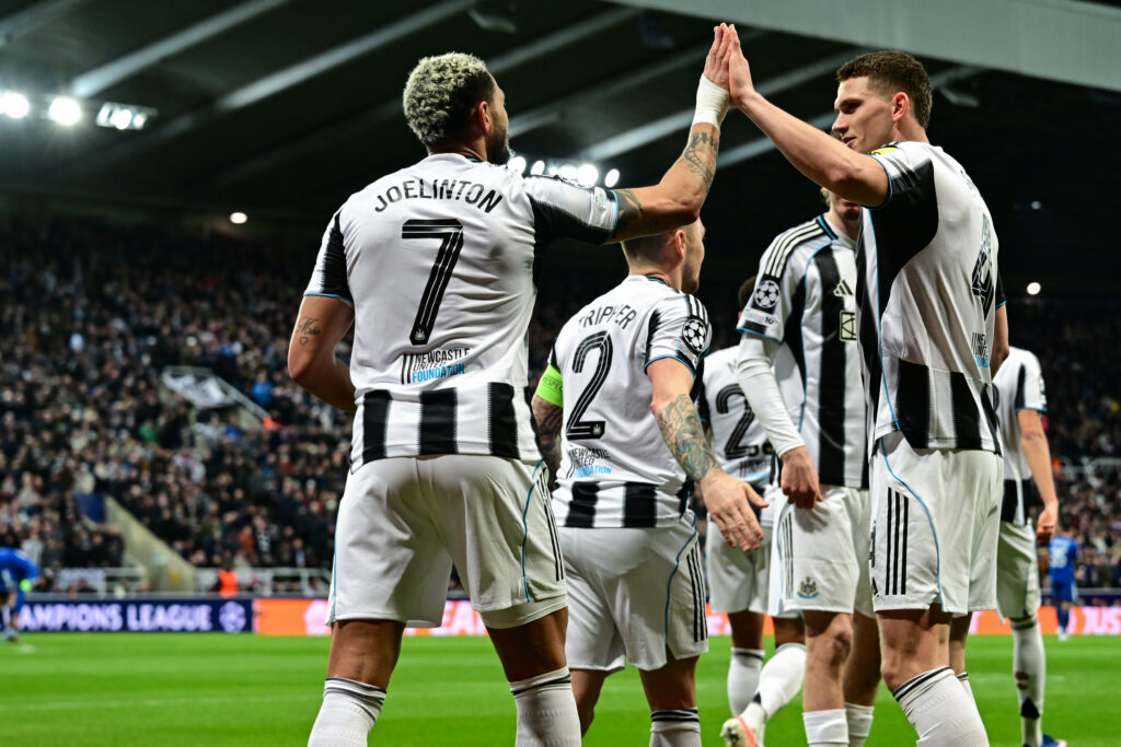 Joelinton celebrates with his Newcastle United teammates after scoring in the Champions League against Qarabag.