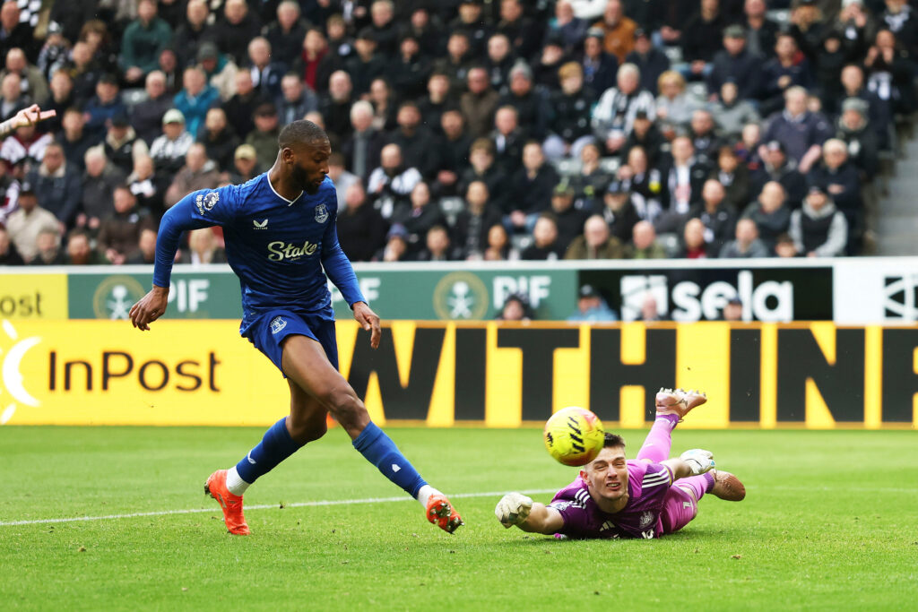 Beto scores Everton's second goal against Newcastle United past goalkeeper Nick Pope.