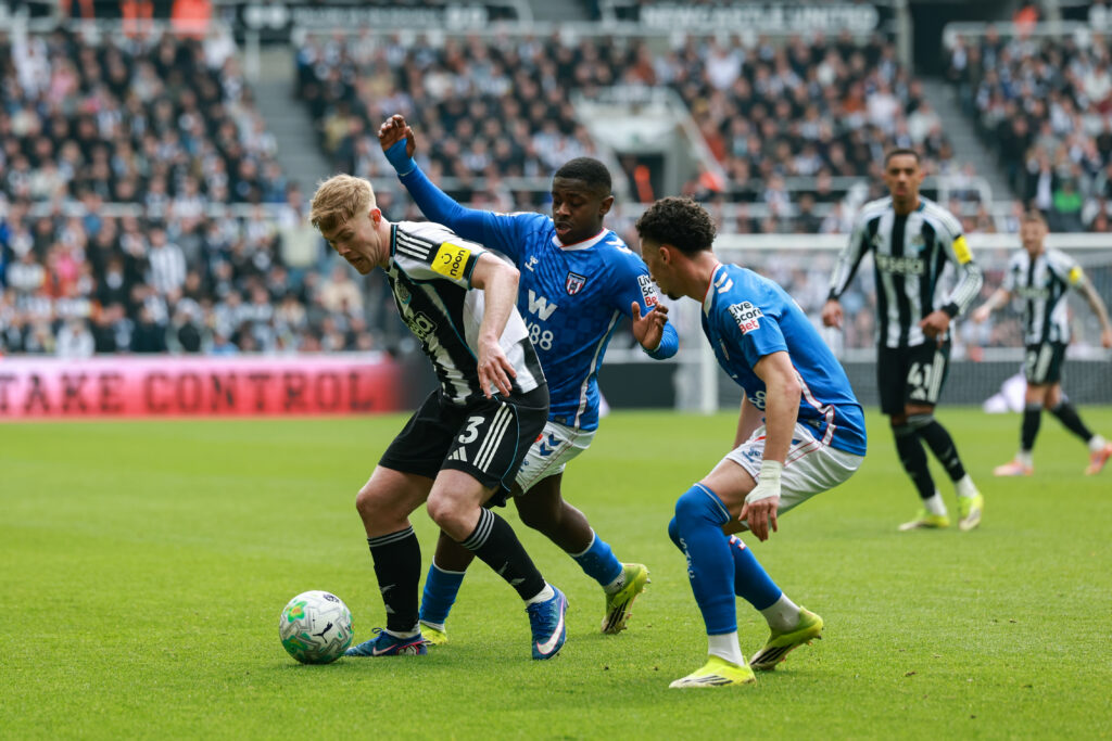 Lewis Hall playing for Newcastle United against Sunderland.