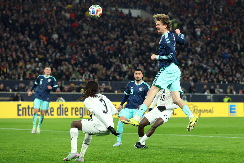 Nick Woltemade heads the ball during Germany's international friendly with Ghana.